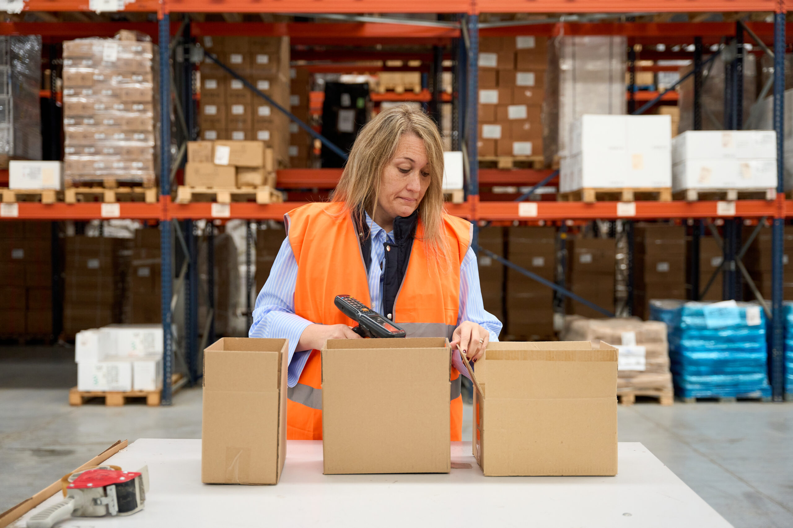 Warehouse worker scanning packages